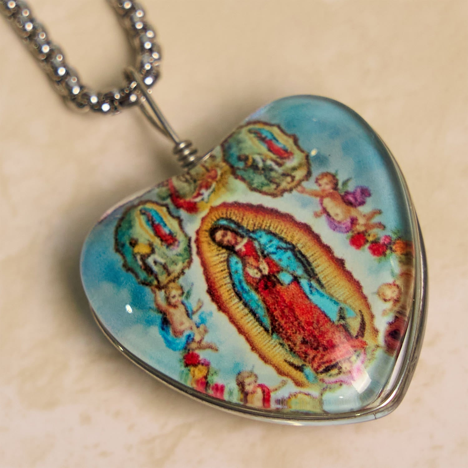 Christianartworkshop Blue Our Lady of Guadalupe Glow-in-the-Dark Heart Shaped Resin Medal Necklace